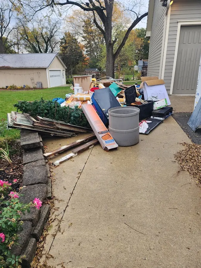 Dumpster being loaded with debris for 3 Yard Dumpster Rental in Gurnee
